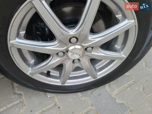 Красный Ниссан Тиида, объемом двигателя 1.5 л и пробегом 76 тыс. км за 8600 $, фото 4 на Automoto.ua