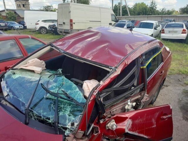 Красный Ниссан Тиида, объемом двигателя 1.6 л и пробегом 94 тыс. км за 3500 $, фото 16 на Automoto.ua