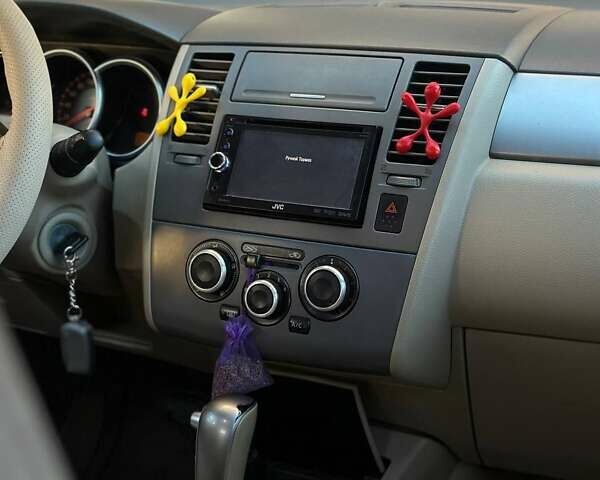 Жовтий Ніссан Тііда, об'ємом двигуна 1.6 л та пробігом 164 тис. км за 5999 $, фото 27 на Automoto.ua