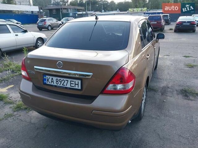 Желтый Ниссан Тиида, объемом двигателя 1.6 л и пробегом 325 тыс. км за 5350 $, фото 3 на Automoto.ua