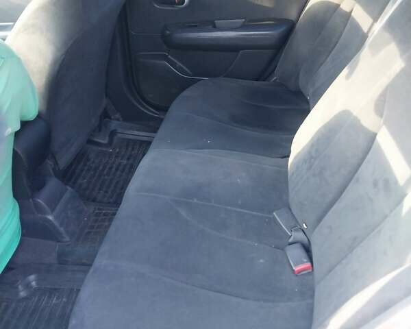 Желтый Ниссан Тиида, объемом двигателя 1.6 л и пробегом 325 тыс. км за 5350 $, фото 13 на Automoto.ua