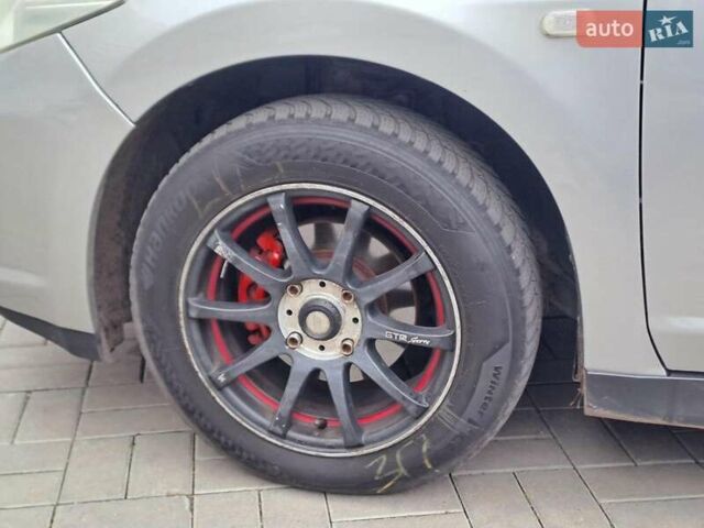 Серый Ниссан Тиида, объемом двигателя 1.6 л и пробегом 182 тыс. км за 6140 $, фото 8 на Automoto.ua