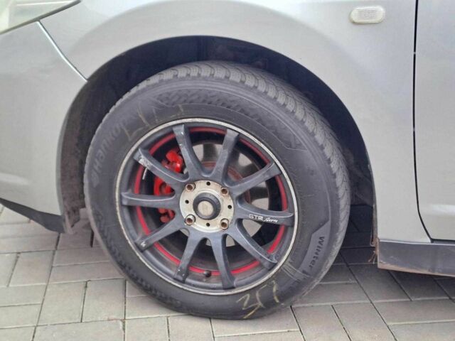 Серый Ниссан Тиида, объемом двигателя 1.6 л и пробегом 182 тыс. км за 6140 $, фото 8 на Automoto.ua