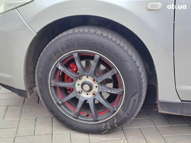 Серый Ниссан Тиида, объемом двигателя 1.6 л и пробегом 182 тыс. км за 6140 $, фото 8 на Automoto.ua