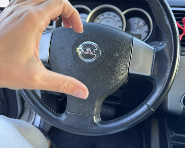 Серый Ниссан Тиида, объемом двигателя 1.5 л и пробегом 106 тыс. км за 8299 $, фото 4 на Automoto.ua