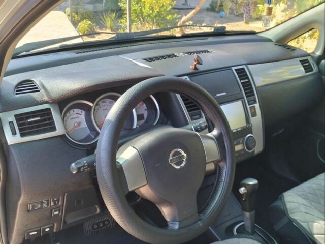 Сірий Ніссан Тііда, об'ємом двигуна 1.5 л та пробігом 150 тис. км за 7800 $, фото 5 на Automoto.ua