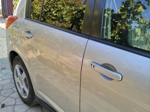 Сірий Ніссан Тііда, об'ємом двигуна 1.5 л та пробігом 150 тис. км за 7800 $, фото 10 на Automoto.ua