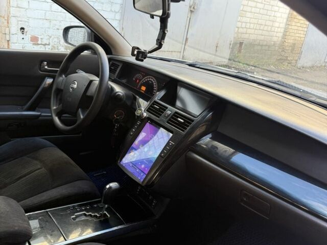 Серый Ниссан Тиида, объемом двигателя 2.4 л и пробегом 380 тыс. км за 4350 $, фото 1 на Automoto.ua