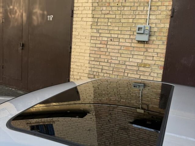 Серый Ниссан Тиида, объемом двигателя 2.4 л и пробегом 380 тыс. км за 4350 $, фото 3 на Automoto.ua