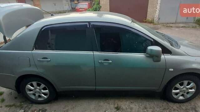 Сірий Ніссан Тііда, об'ємом двигуна 1.8 л та пробігом 199 тис. км за 4740 $, фото 2 на Automoto.ua