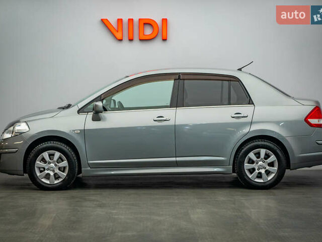 Серый Ниссан Тиида, объемом двигателя 1.6 л и пробегом 166 тыс. км за 6997 $, фото 2 на Automoto.ua