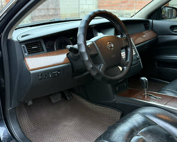 Черный Ниссан Теана, объемом двигателя 2.3 л и пробегом 334 тыс. км за 5500 $, фото 10 на Automoto.ua