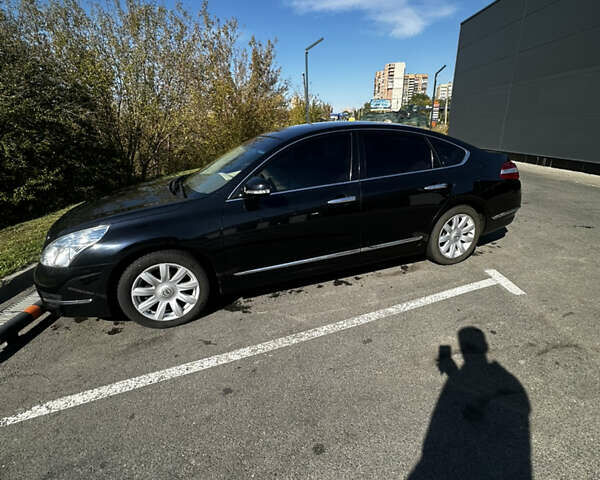 Черный Ниссан Теана, объемом двигателя 2.5 л и пробегом 71 тыс. км за 10000 $, фото 1 на Automoto.ua