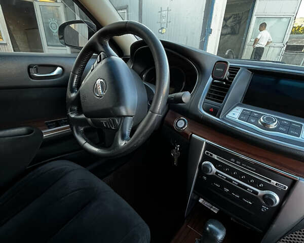 Черный Ниссан Теана, объемом двигателя 2.5 л и пробегом 286 тыс. км за 7400 $, фото 6 на Automoto.ua