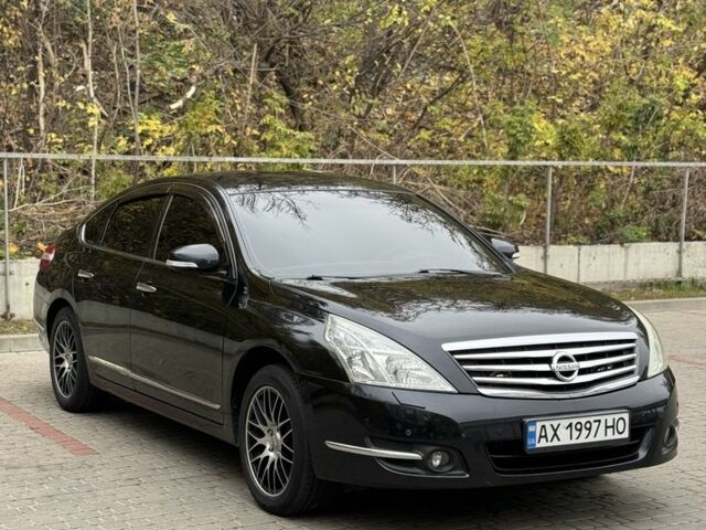 Черный Ниссан Теана, объемом двигателя 2.5 л и пробегом 246 тыс. км за 6100 $, фото 1 на Automoto.ua