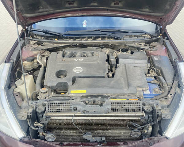 Ниссан Теана 2010 в Сумах на Automoto.ua Красный Ниссан Теана, объемом двигателя 3.5 л и пробегом 260 тыс. км за 7300 $, фото 27 на Automoto.ua