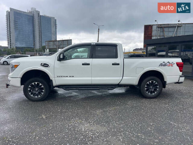 Белый Ниссан Титан, объемом двигателя 4.98 л и пробегом 330 тыс. км за 30000 $, фото 1 на Automoto.ua