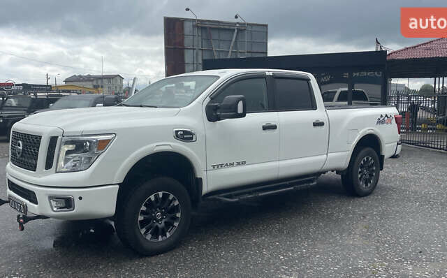 Белый Ниссан Титан, объемом двигателя 4.98 л и пробегом 330 тыс. км за 30000 $, фото 2 на Automoto.ua