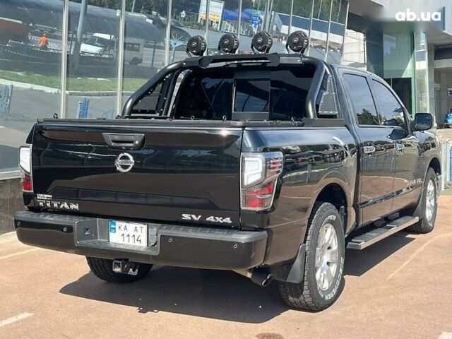 Черный Ниссан Титан, объемом двигателя 5.6 л и пробегом 69 тыс. км за 39999 $, фото 3 на Automoto.ua