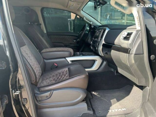 Черный Ниссан Титан, объемом двигателя 5.6 л и пробегом 69 тыс. км за 39999 $, фото 9 на Automoto.ua