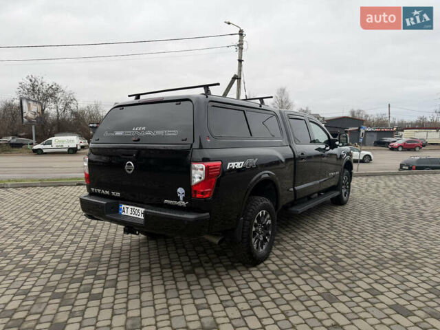Чорний Ніссан Титан, об'ємом двигуна 5 л та пробігом 79 тис. км за 52000 $, фото 4 на Automoto.ua