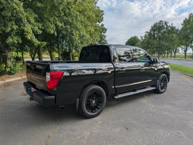 Черный Ниссан Титан, объемом двигателя 5.6 л и пробегом 160 тыс. км за 26999 $, фото 10 на Automoto.ua