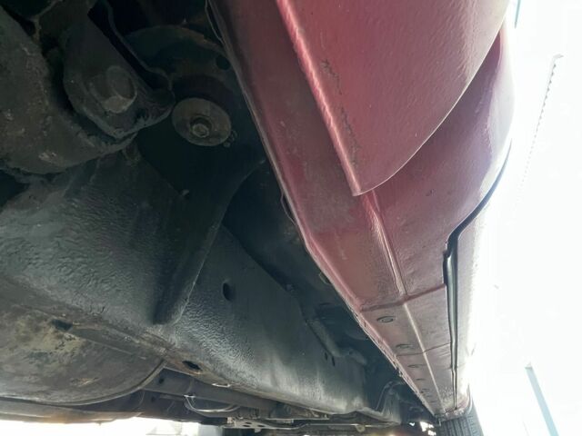 Красный Ниссан Титан, объемом двигателя 5.6 л и пробегом 270 тыс. км за 8500 $, фото 7 на Automoto.ua