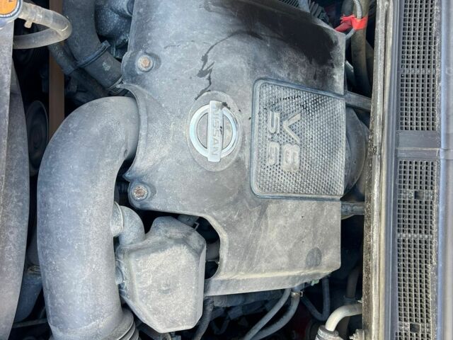 Красный Ниссан Титан, объемом двигателя 5.6 л и пробегом 270 тыс. км за 8500 $, фото 6 на Automoto.ua