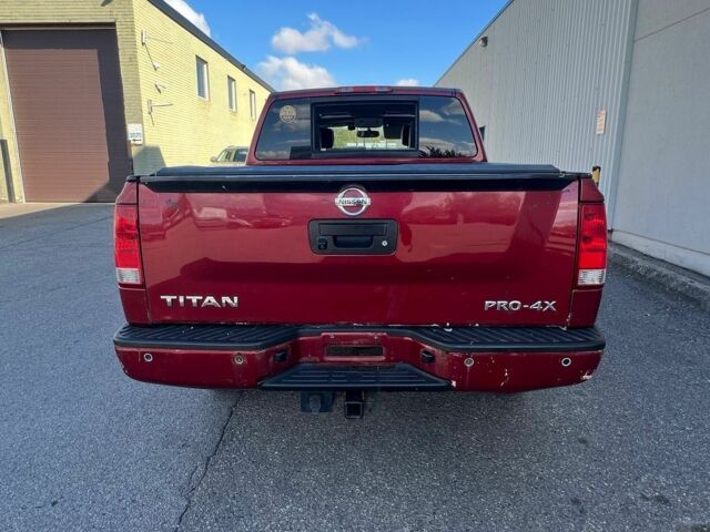 Красный Ниссан Титан, объемом двигателя 5.6 л и пробегом 270 тыс. км за 8500 $, фото 2 на Automoto.ua