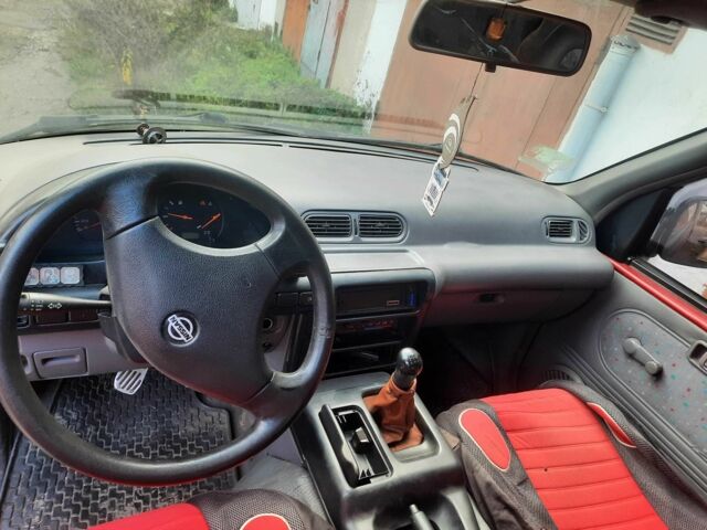 Красный Ниссан Ванетте, объемом двигателя 2.3 л и пробегом 370 тыс. км за 1277 $, фото 3 на Automoto.ua