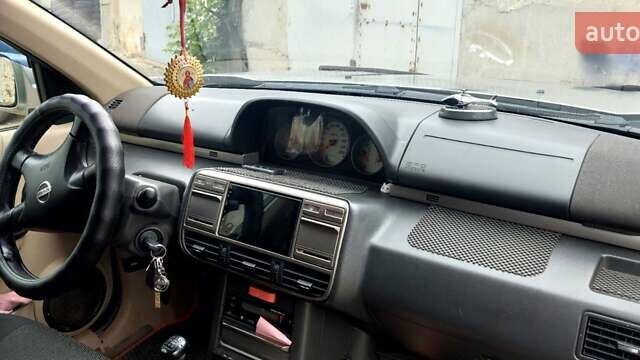 Бежевый Ниссан ИксТрейл, объемом двигателя 2 л и пробегом 375 тыс. км за 5500 $, фото 4 на Automoto.ua