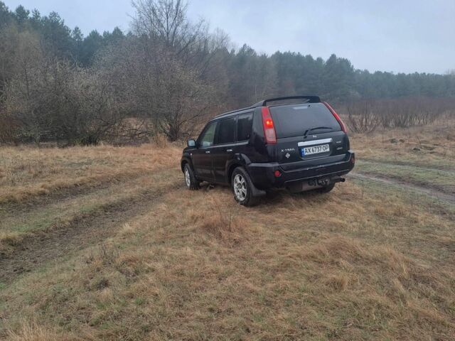 Черный Ниссан ИксТрейл, объемом двигателя 2.2 л и пробегом 290 тыс. км за 4500 $, фото 8 на Automoto.ua