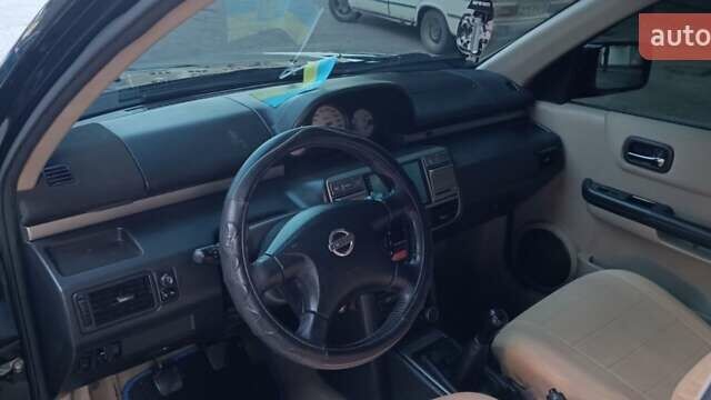 Черный Ниссан ИксТрейл, объемом двигателя 2 л и пробегом 300 тыс. км за 6300 $, фото 10 на Automoto.ua