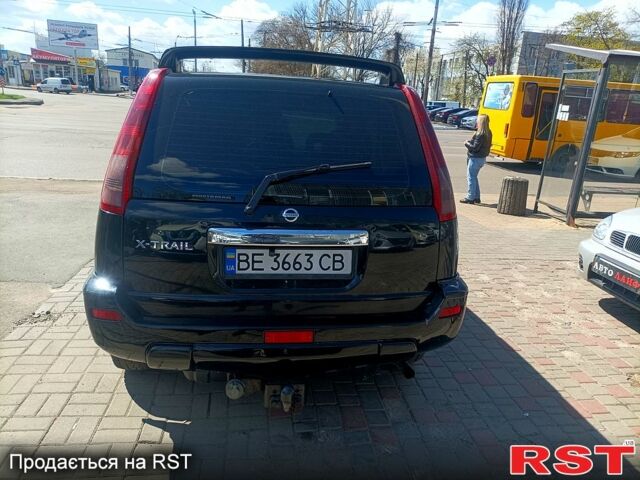 Черный Ниссан ИксТрейл, объемом двигателя 2.2 л и пробегом 333 тыс. км за 6500 $, фото 7 на Automoto.ua
