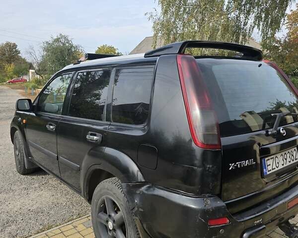 Черный Ниссан ИксТрейл, объемом двигателя 2.2 л и пробегом 300 тыс. км за 3300 $, фото 2 на Automoto.ua