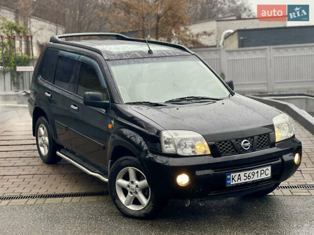 Черный Ниссан ИксТрейл, объемом двигателя 2 л и пробегом 320 тыс. км за 5600 $, фото 19 на Automoto.ua