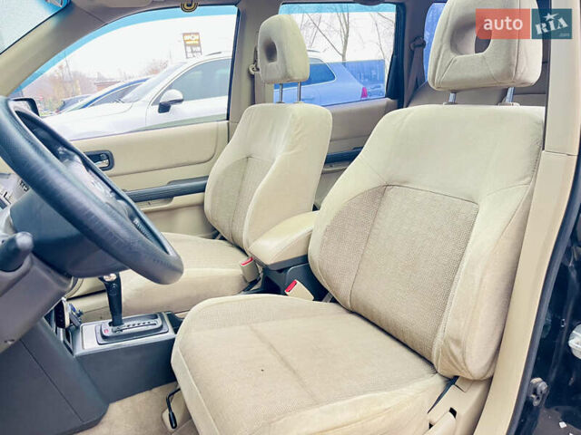 Черный Ниссан ИксТрейл, объемом двигателя 2 л и пробегом 320 тыс. км за 5600 $, фото 6 на Automoto.ua