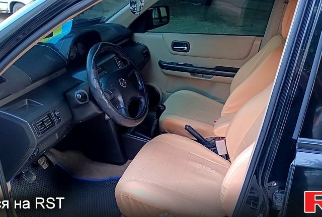 Черный Ниссан ИксТрейл, объемом двигателя 2 л и пробегом 257 тыс. км за 5800 $, фото 9 на Automoto.ua