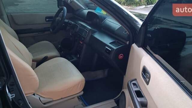 Черный Ниссан ИксТрейл, объемом двигателя 2 л и пробегом 300 тыс. км за 6300 $, фото 12 на Automoto.ua