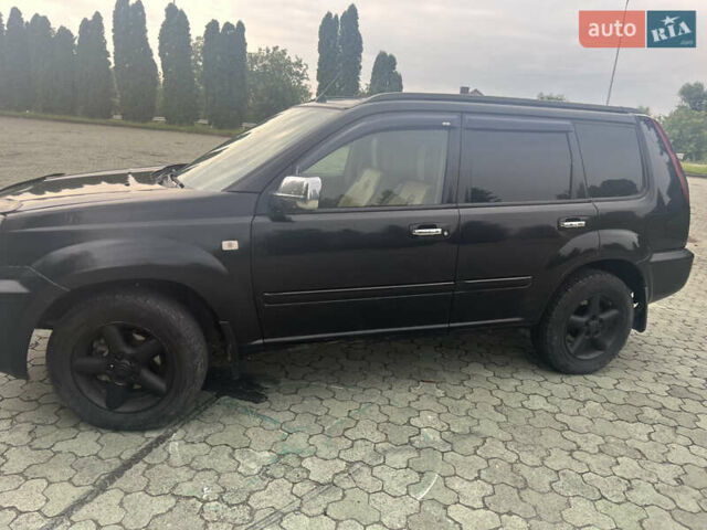 Черный Ниссан ИксТрейл, объемом двигателя 2.2 л и пробегом 356 тыс. км за 6000 $, фото 2 на Automoto.ua