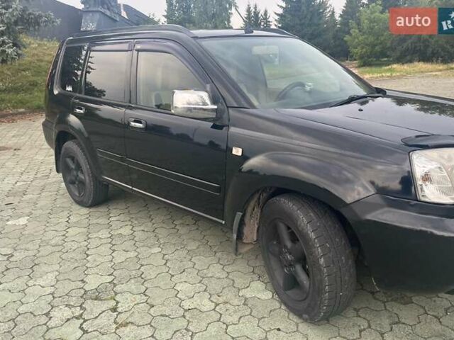 Черный Ниссан ИксТрейл, объемом двигателя 2.2 л и пробегом 356 тыс. км за 6000 $, фото 4 на Automoto.ua