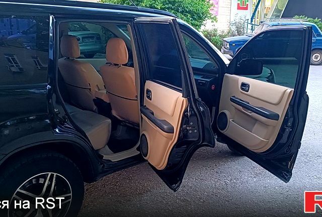 Черный Ниссан ИксТрейл, объемом двигателя 2 л и пробегом 257 тыс. км за 5800 $, фото 11 на Automoto.ua