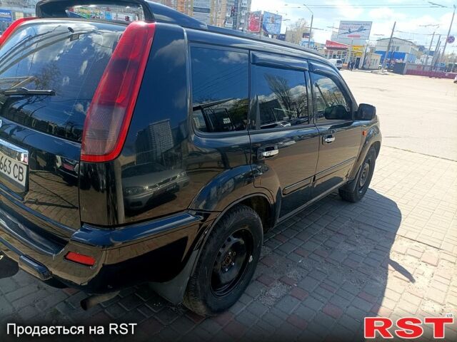 Черный Ниссан ИксТрейл, объемом двигателя 2.2 л и пробегом 333 тыс. км за 6500 $, фото 5 на Automoto.ua