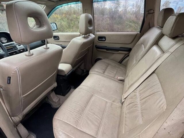 Черный Ниссан ИксТрейл, объемом двигателя 2.2 л и пробегом 300 тыс. км за 4000 $, фото 7 на Automoto.ua