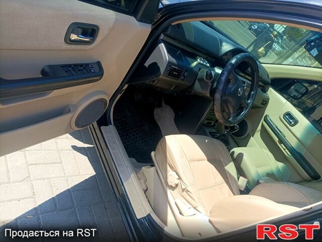 Черный Ниссан ИксТрейл, объемом двигателя 2.2 л и пробегом 333 тыс. км за 6500 $, фото 8 на Automoto.ua