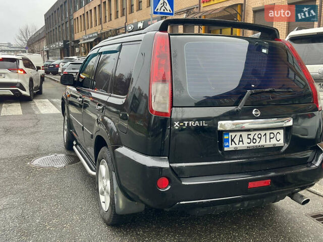 Черный Ниссан ИксТрейл, объемом двигателя 2 л и пробегом 320 тыс. км за 5600 $, фото 2 на Automoto.ua