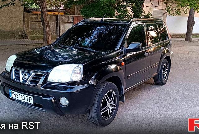 Черный Ниссан ИксТрейл, объемом двигателя 2 л и пробегом 257 тыс. км за 5800 $, фото 1 на Automoto.ua