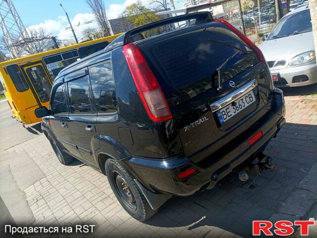 Черный Ниссан ИксТрейл, объемом двигателя 2.2 л и пробегом 333 тыс. км за 6500 $, фото 6 на Automoto.ua