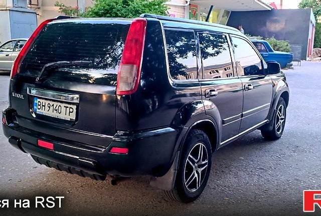 Черный Ниссан ИксТрейл, объемом двигателя 2 л и пробегом 257 тыс. км за 5800 $, фото 5 на Automoto.ua