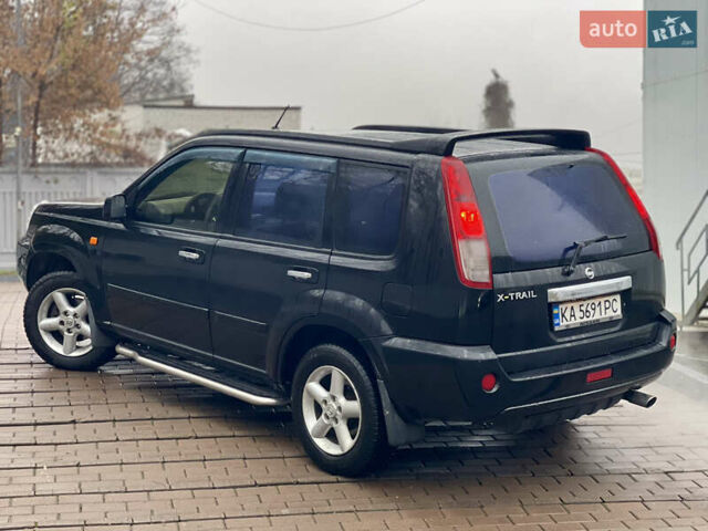 Черный Ниссан ИксТрейл, объемом двигателя 2 л и пробегом 320 тыс. км за 5600 $, фото 18 на Automoto.ua